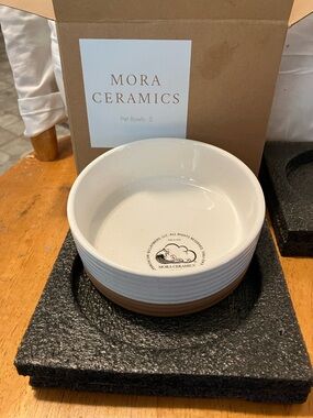 New.  Mora Ceramics tan n white dog bowl in perfect condition
